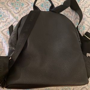 Black Steve Madden book bag.